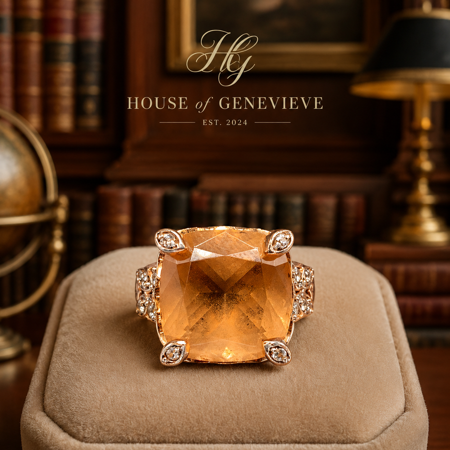 Rose gold-tone cocktail ring with large cushion-cut peach stone and pavé shoulders