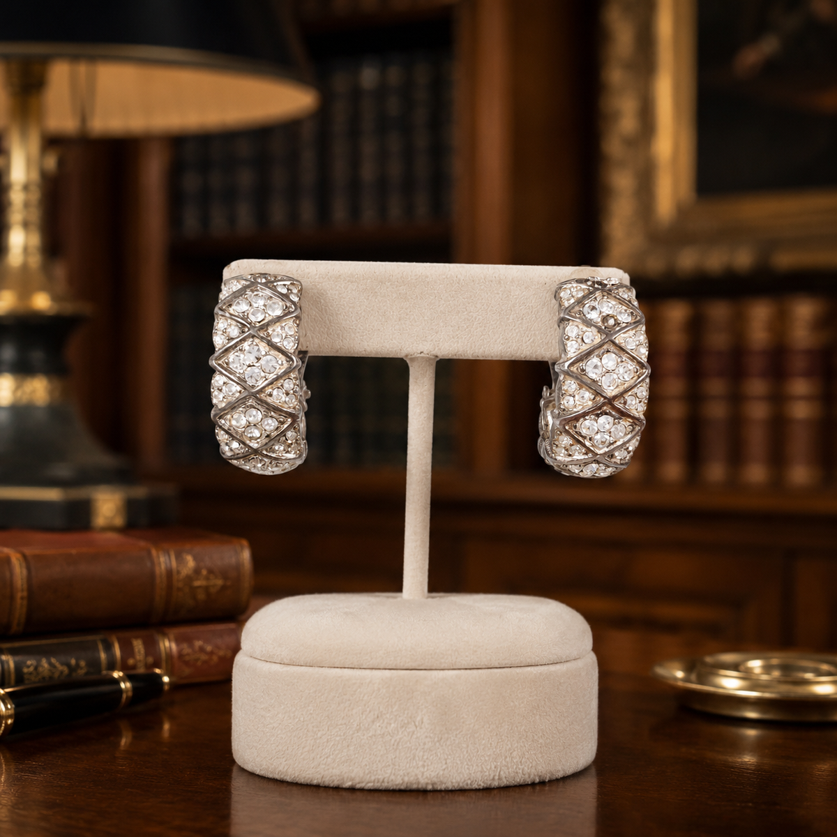 Silver-tone J-hoop clip earrings with raised lattice pattern pavé-set with clear crystals