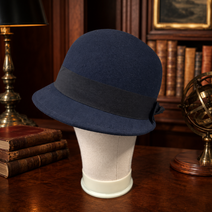 Navy blue felt cloche hat with black grosgrain ribbon band and side bow