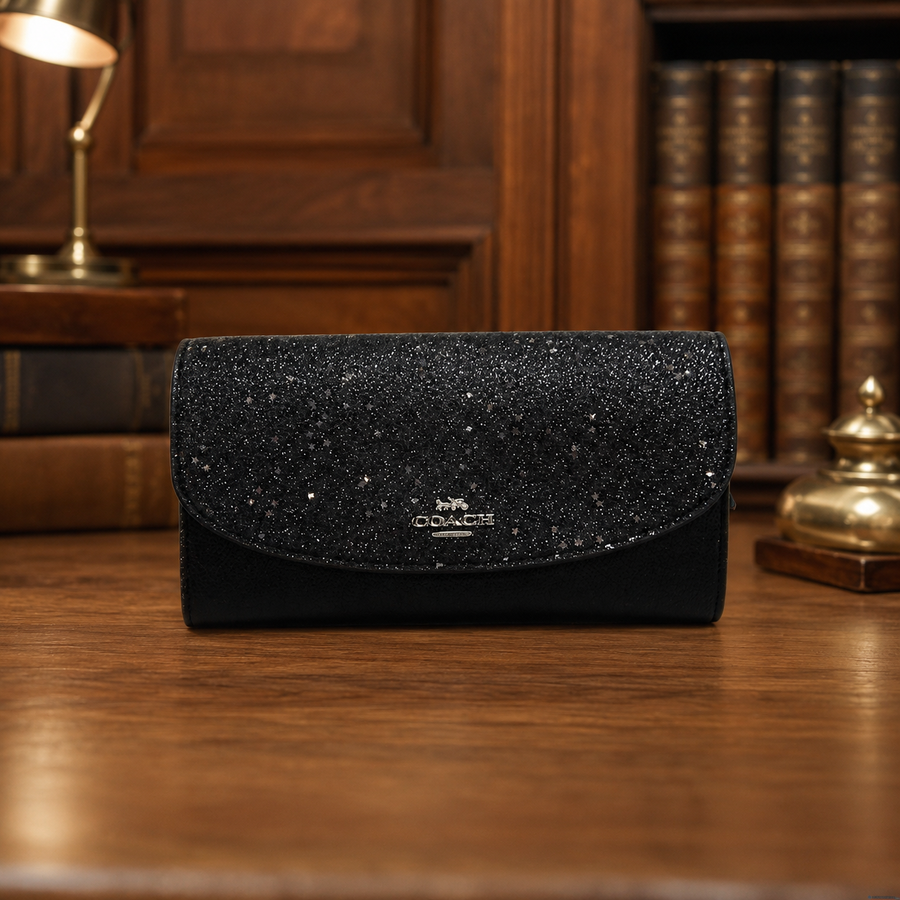 Coach black envelope wallet with glitter flap and silver-tone logo plaque