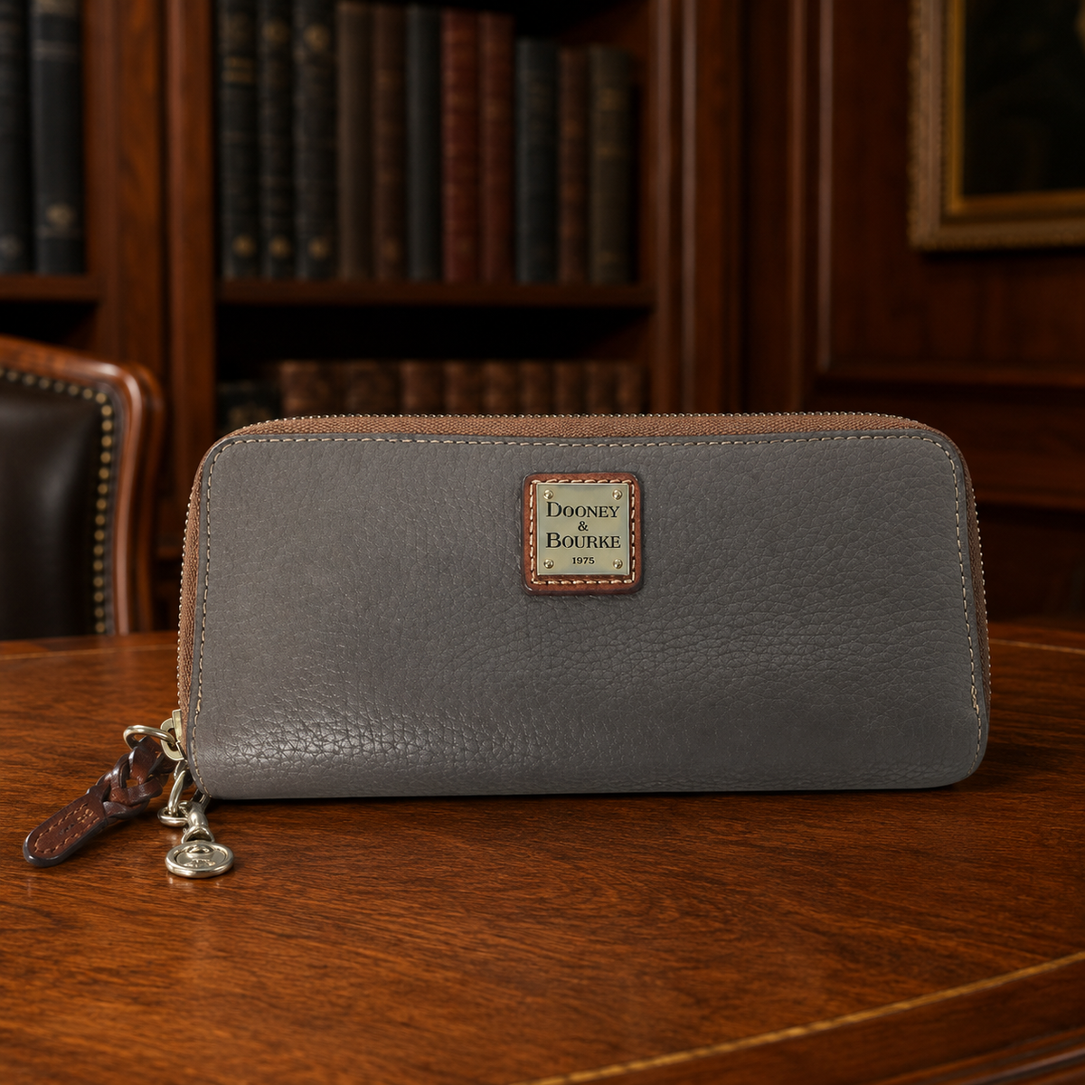 Dooney & Bourke elephant gray pebbled leather double zip around wallet clutch with tan trim