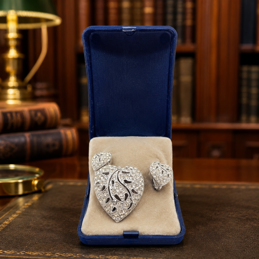 Signed HEDY silver-tone heart brooch and screw-back earrings with champagne rhinestones in navy box