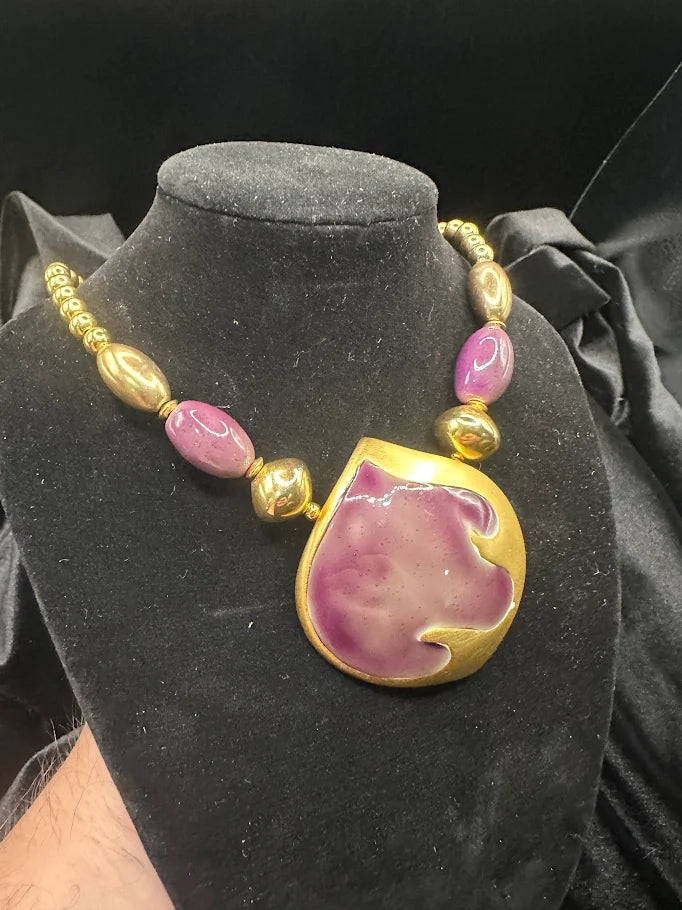 Gold-tone necklace with large purple enamel pendant and purple bead accents, view 2