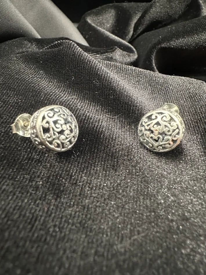 Silver-tone round dome stud earrings with openwork filigree scroll design, view 2