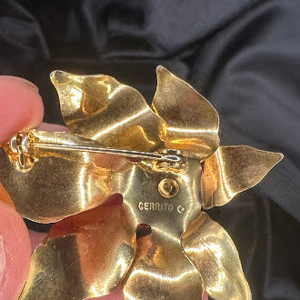 Signed Cerrito gold-tone poinsettia brooch with red enamel petals showing enamel wear, view 4
