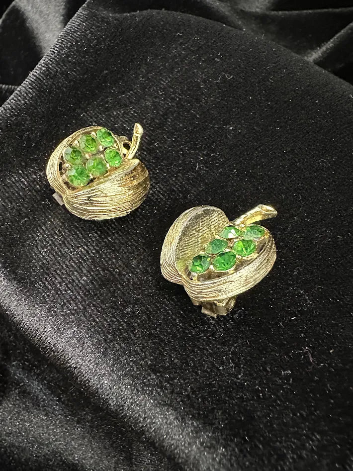 Gold-tone textured basket clip earrings filled with green faceted crystals, view 3