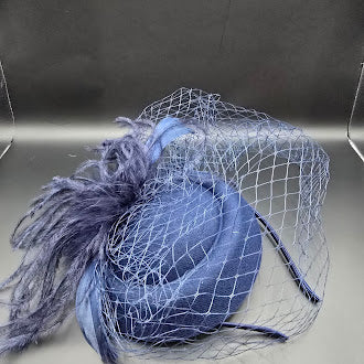 Blue felt pillbox hat with net veil and feather spray