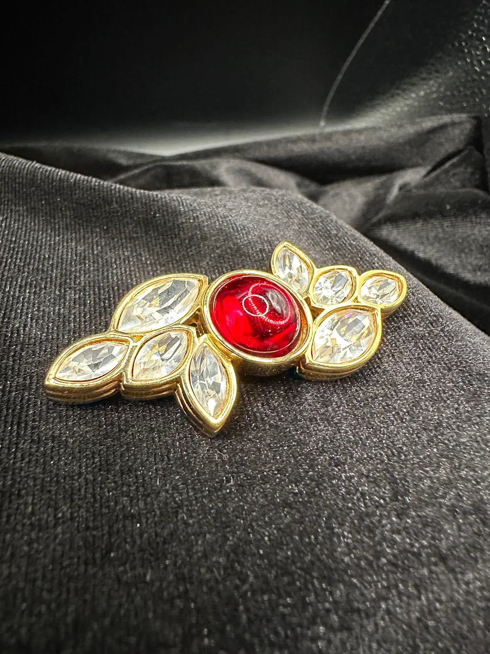 Gold-tone leaf brooch with red cabochon center and clear marquise crystals, view 3
