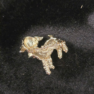 Gold tone lamb brooch with textured finish and teal bow detail