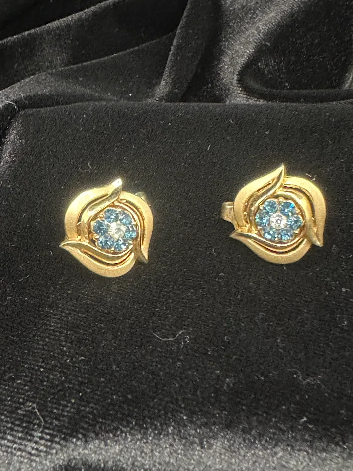 Gold-tone swirl floral clip-on earrings with faceted blue crystal centers, view 2