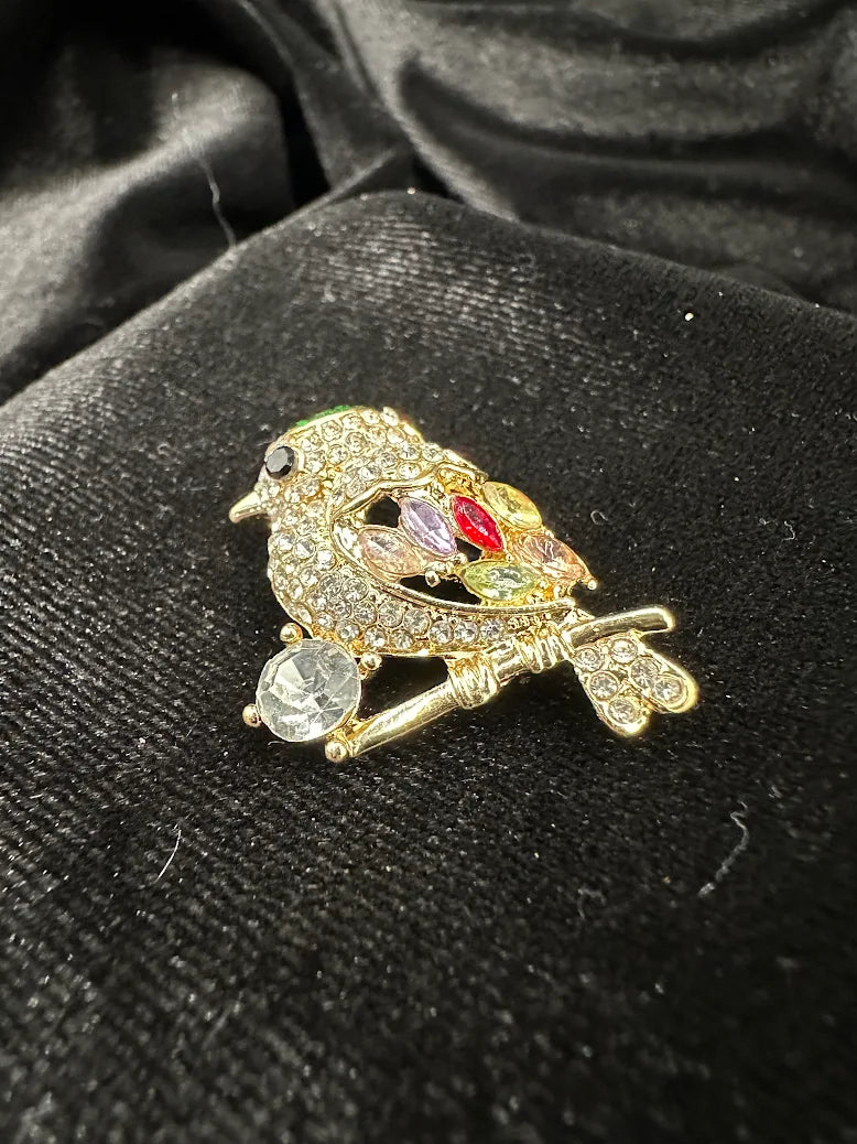 Gold-tone perched bird brooch with clear pavé body and multicolor rhinestone wing, view 3