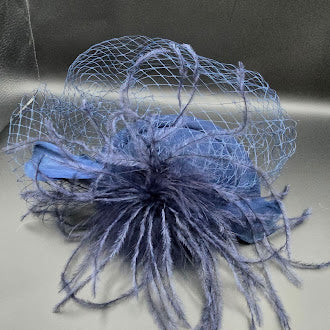 Blue felt pillbox hat with net veil and feather spray