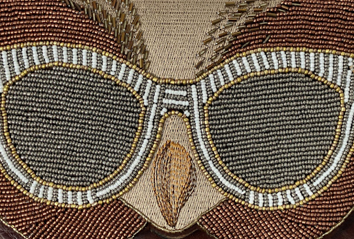 British tan leather crossbody with beaded owl face on the front panel, view 4
