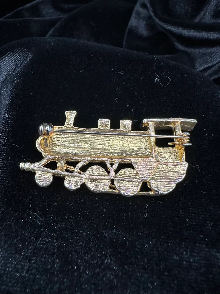 Gold-tone steam locomotive brooch with smokestack, cab, cowcatcher and raised wheels, view 2