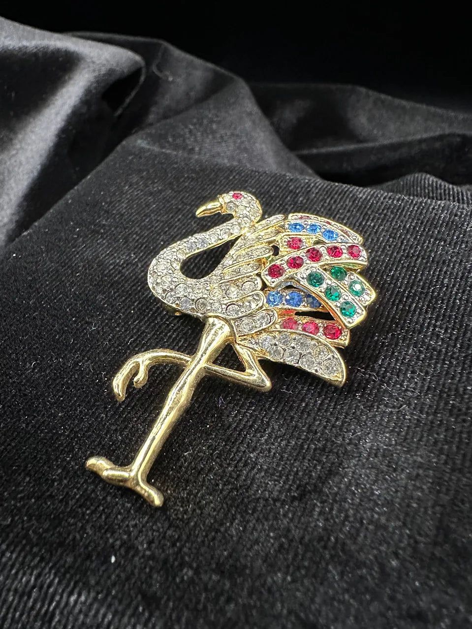 Gold-tone standing flamingo brooch with clear crystals and red, blue and green wing accents, view 2