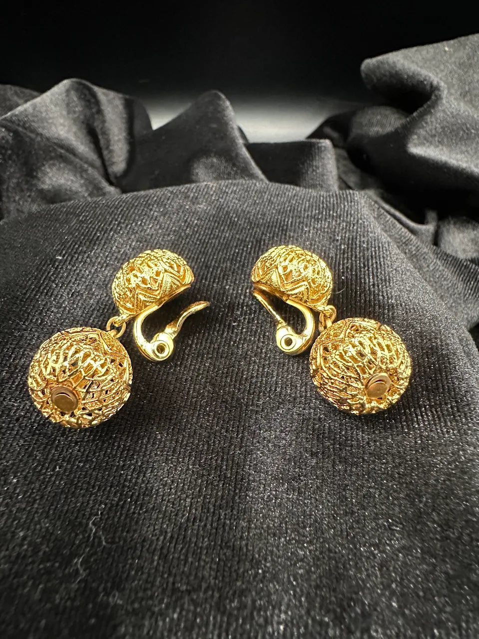 Signed Monet gold-tone rounded filigree clip earrings, view 2