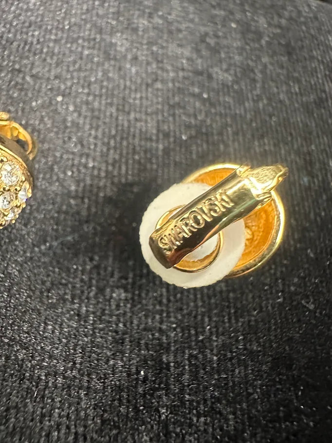 Signed Swarovski gold-tone dome button clip earrings with clear crystal accents, view 4