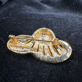 Red crystal hat brooch with curved brim, darker crystal band and gold-tone lines, view 5