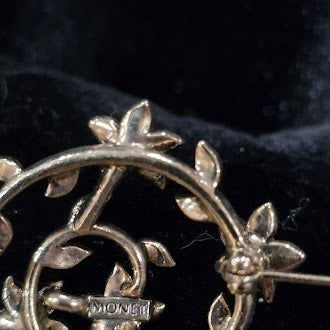 Signed Monet gold-tone vine wreath brooch with clear, lavender and green rhinestones, view 5