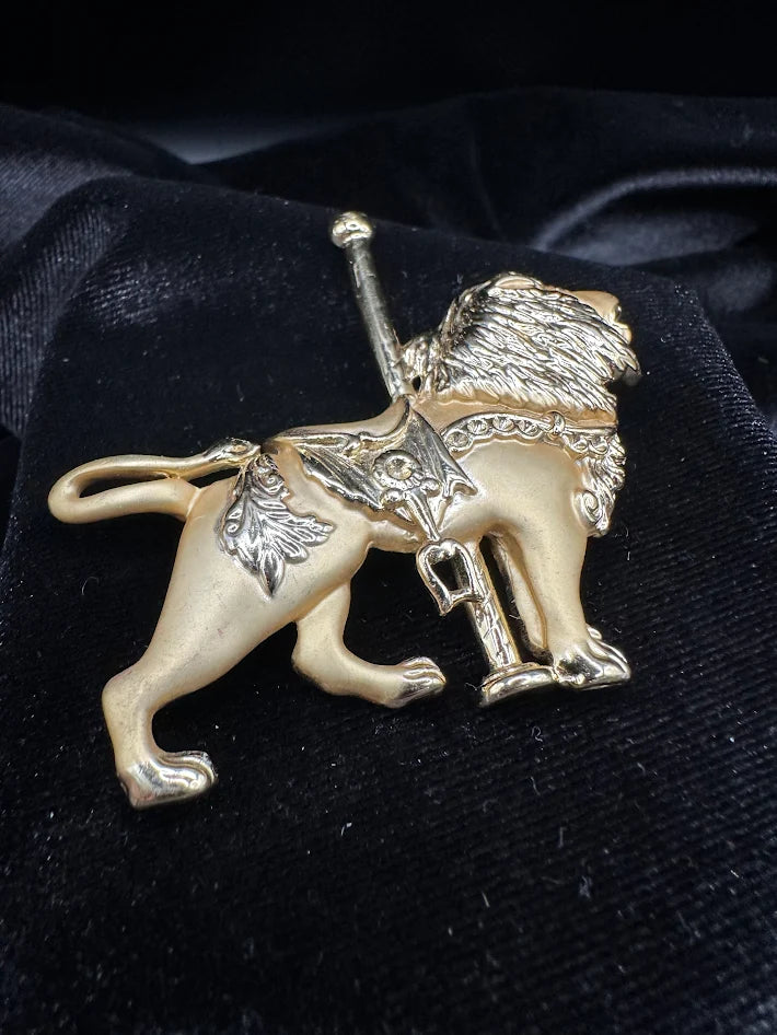 Vintage Enamel Gold tone carousel lion brooch with textured mane and saddle detail
