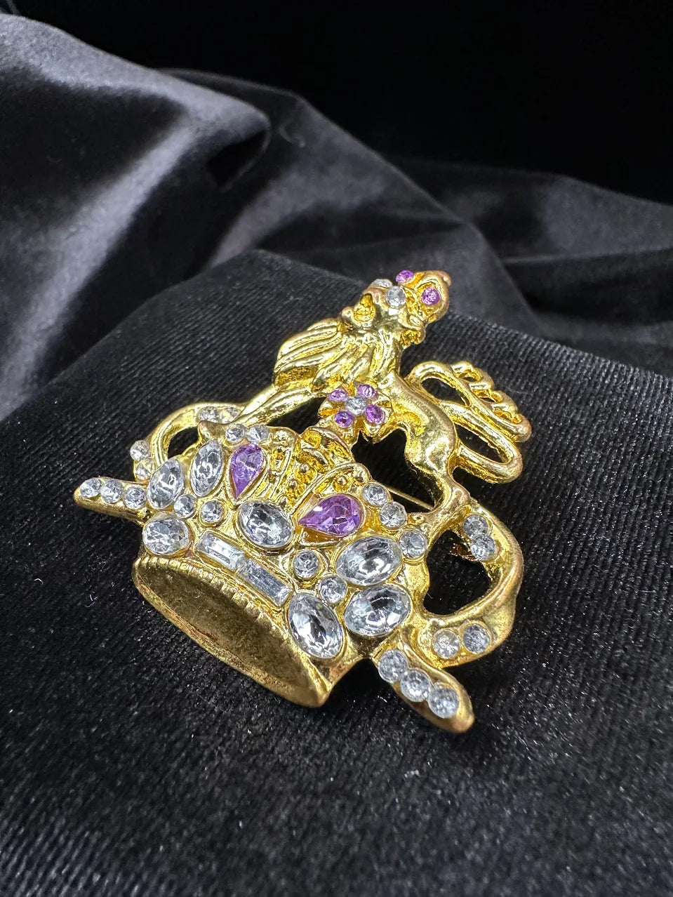 Gold-tone ornate crown brooch topped with a lion, set with clear and purple crystals, view 3