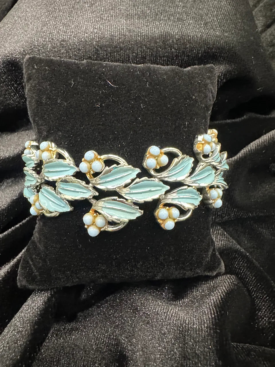 Silver-tone openwork bracelet with blue leaves and pale blue bead flowers, view 3