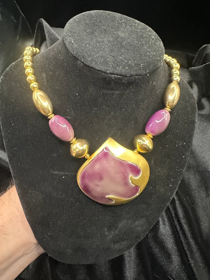 Gold-tone necklace with large purple enamel pendant and purple bead accents, view 4