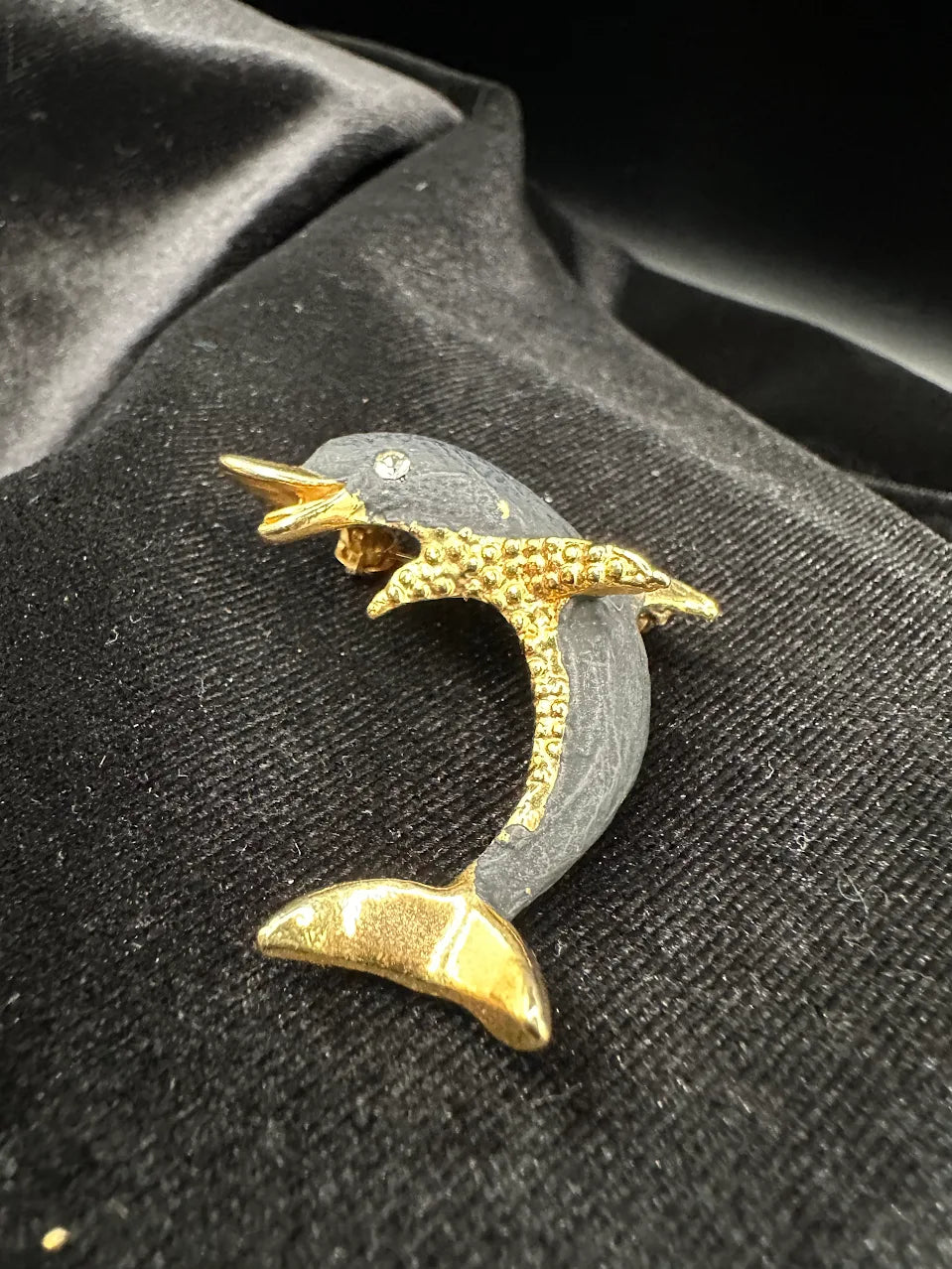 Gold-tone leaping dolphin brooch with gray body and clear crystal accents, view 2