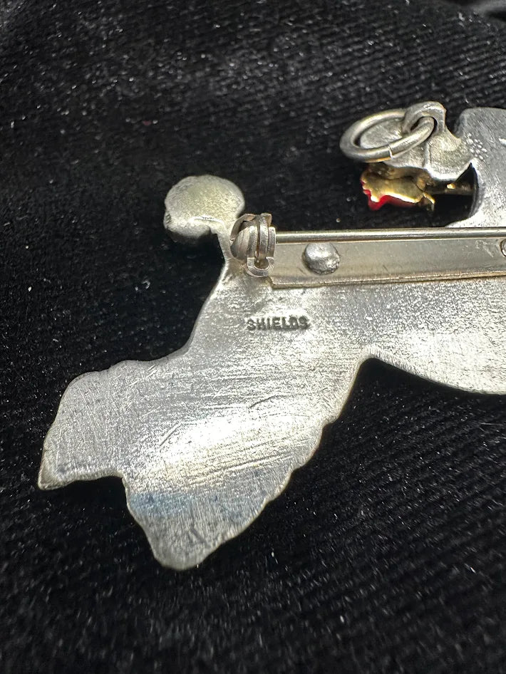 Signed Shields pewter-tone leaping poodle brooch holding a red rose, view 3