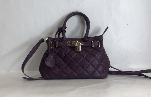 Purple quilted satchel with gold-tone front lock and belted accent, view 2