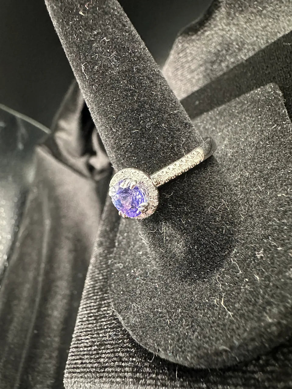 Silver-tone ring with round purple crystal center and clear crystal halo, view 4