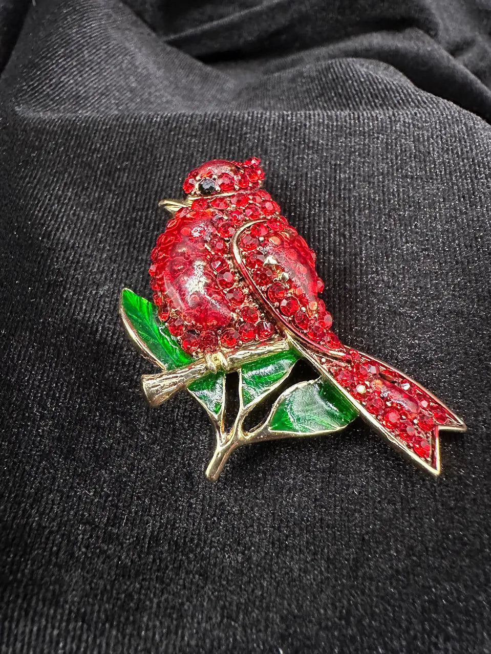 Gold-tone cardinal bird brooch with red crystal body and green enamel-style leaves, view 6