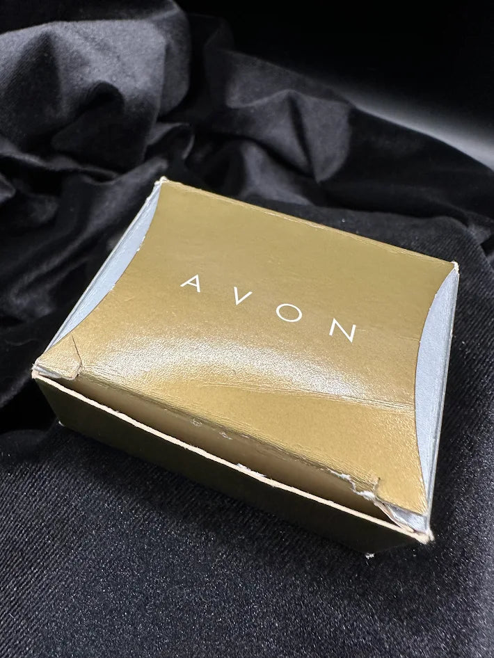 Avon brooch of two cream bunnies on a floral base with faux pearls and pink bow, with Avon box, view 2