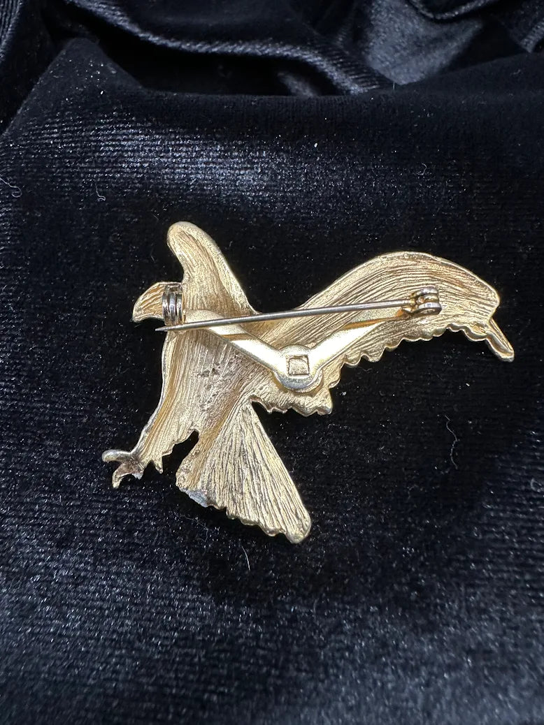 Textured gold-tone eagle brooch with wings extended in flight, view 5