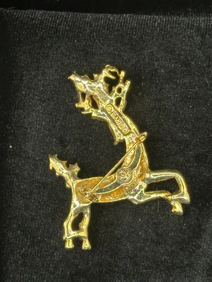 Gold-tone leaping reindeer Christmas brooch with green enamel holly and red rhinestone, view 4