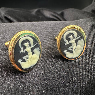 Gold-tone oval cameo-style cufflinks with raised light figure on dark ground, view 3