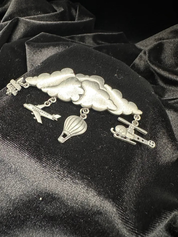 Signed JJ silver-tone cloud brooch with dangling airplanes, helicopter and hot air balloon, view 5