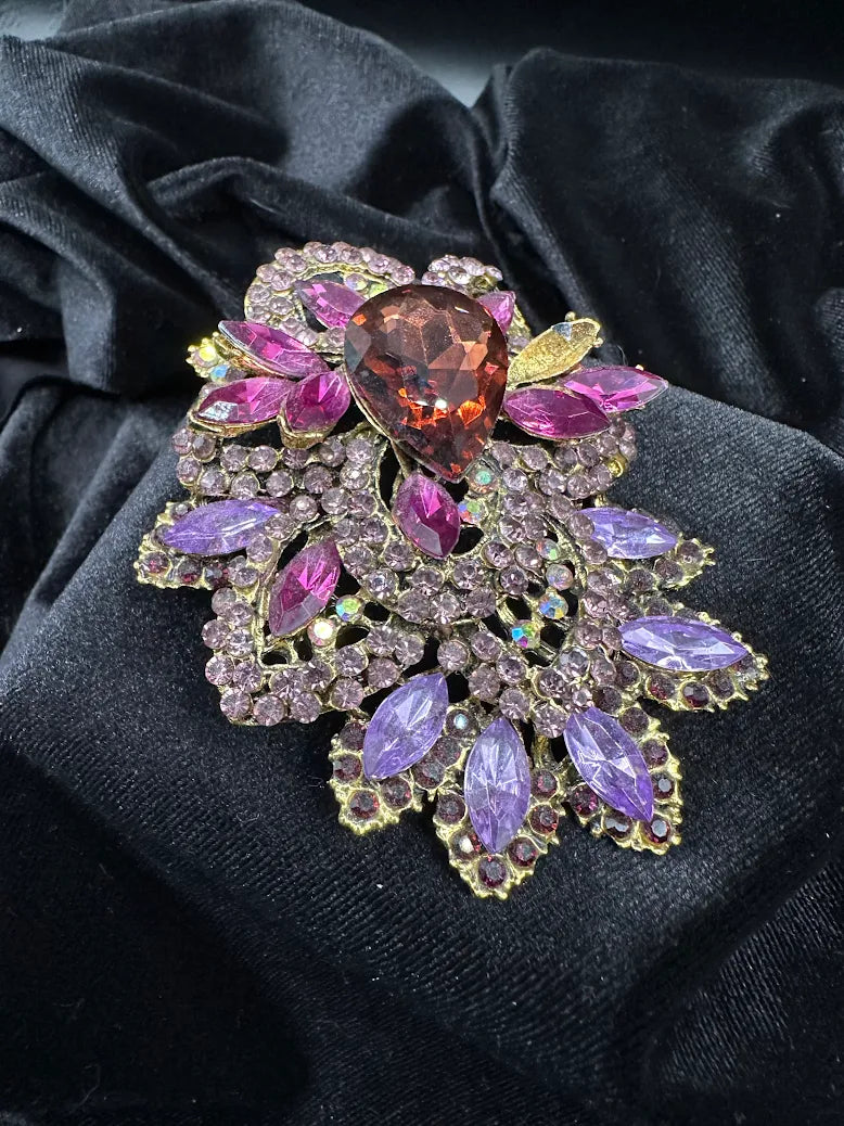 Large gold-tone floral brooch with pear-shaped purple center and pink, violet and aurora stones, view 2