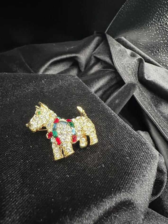 (SIGNED?) Gold tone terrier brooch with clear red green and blue crystals