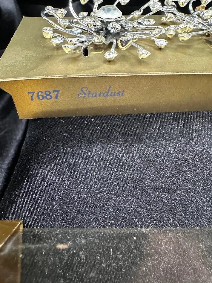 Sarah Coventry silver-tone starburst earrings with clear crystals and original packaging, view 5