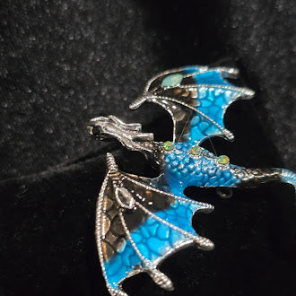 Silver-tone flying dragon brooch with blue enamel wings and rhinestone accents, view 2