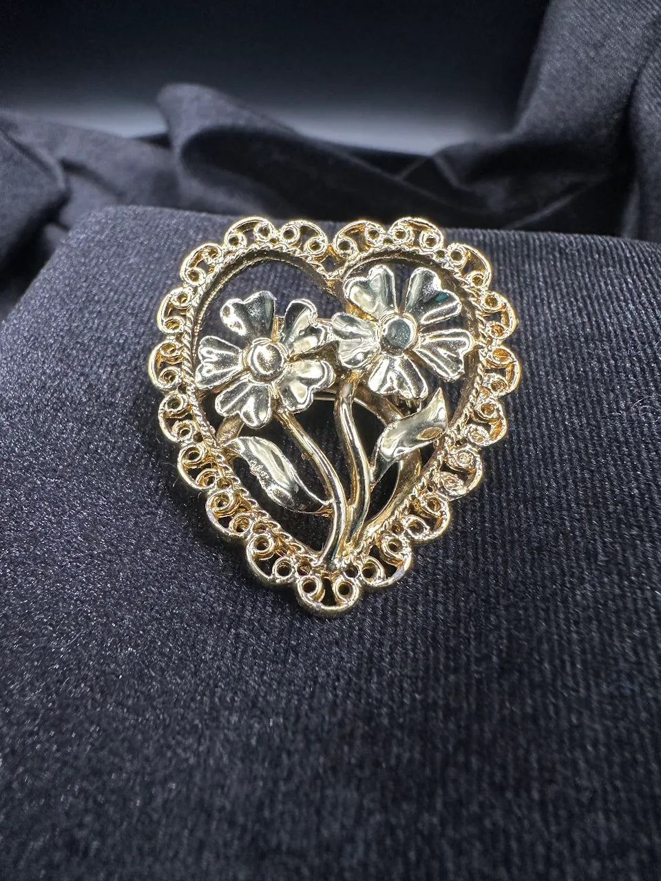 Gold-tone heart brooch with openwork border and raised flower design, view 6
