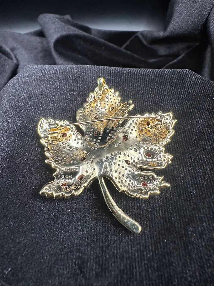 Gold-tone rhinestone maple leaf brooch with red-orange accent stones, view 4