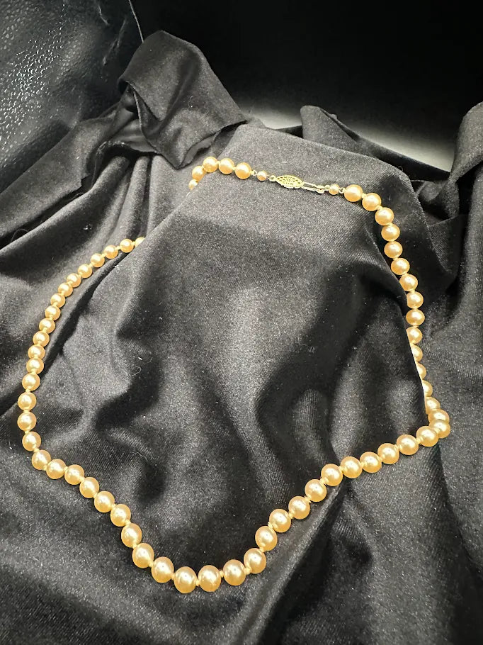 Gold Tone Cream Pearl Style Necklace with Decorative Clasp
