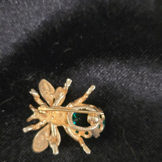 CINI gold tone insect brooch with green crystal bodySigned CINI Sterling Silver Vermeil Bee Brooch with Emerald Green Faceted Stone, Mid Century Designer Insect Pin
