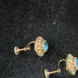 Gold-tone brooch and matching screw-back earrings with blue center stones and clear rhinestone halos, view 3