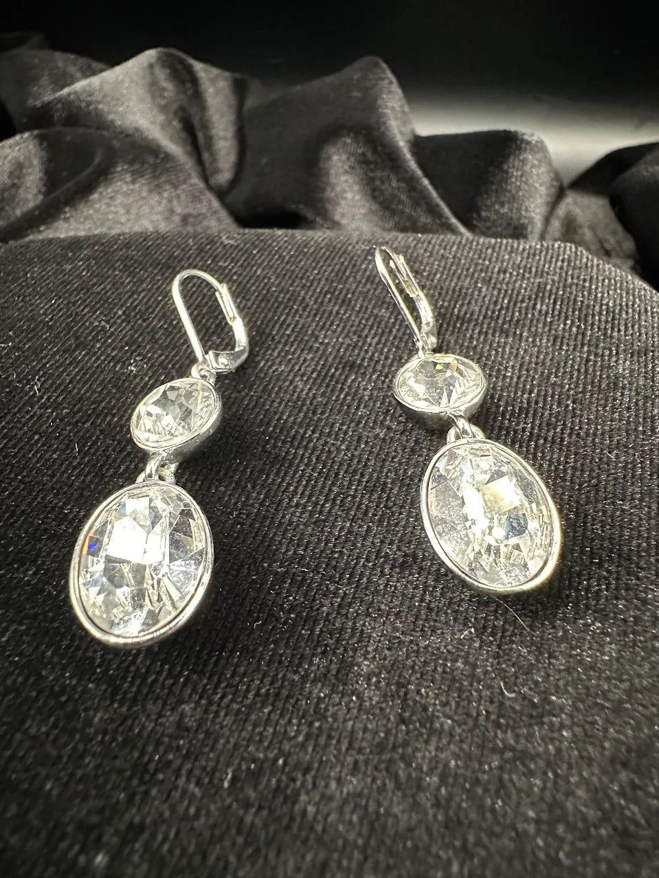 Signed Givenchy silver-tone drop earrings with oval clear crystal below a round stone, view 2
