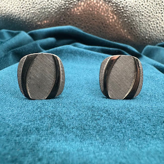 Vintage silver tone oval tie tack set with brushed textured panel design and chain back