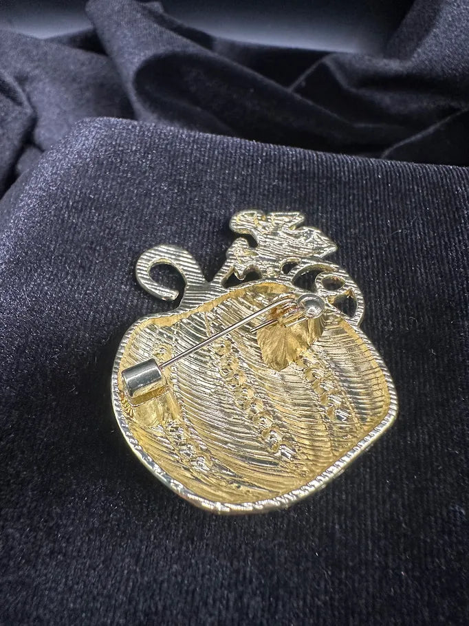 Gold-tone orange pumpkin brooch with clear rhinestone stripes, view 4