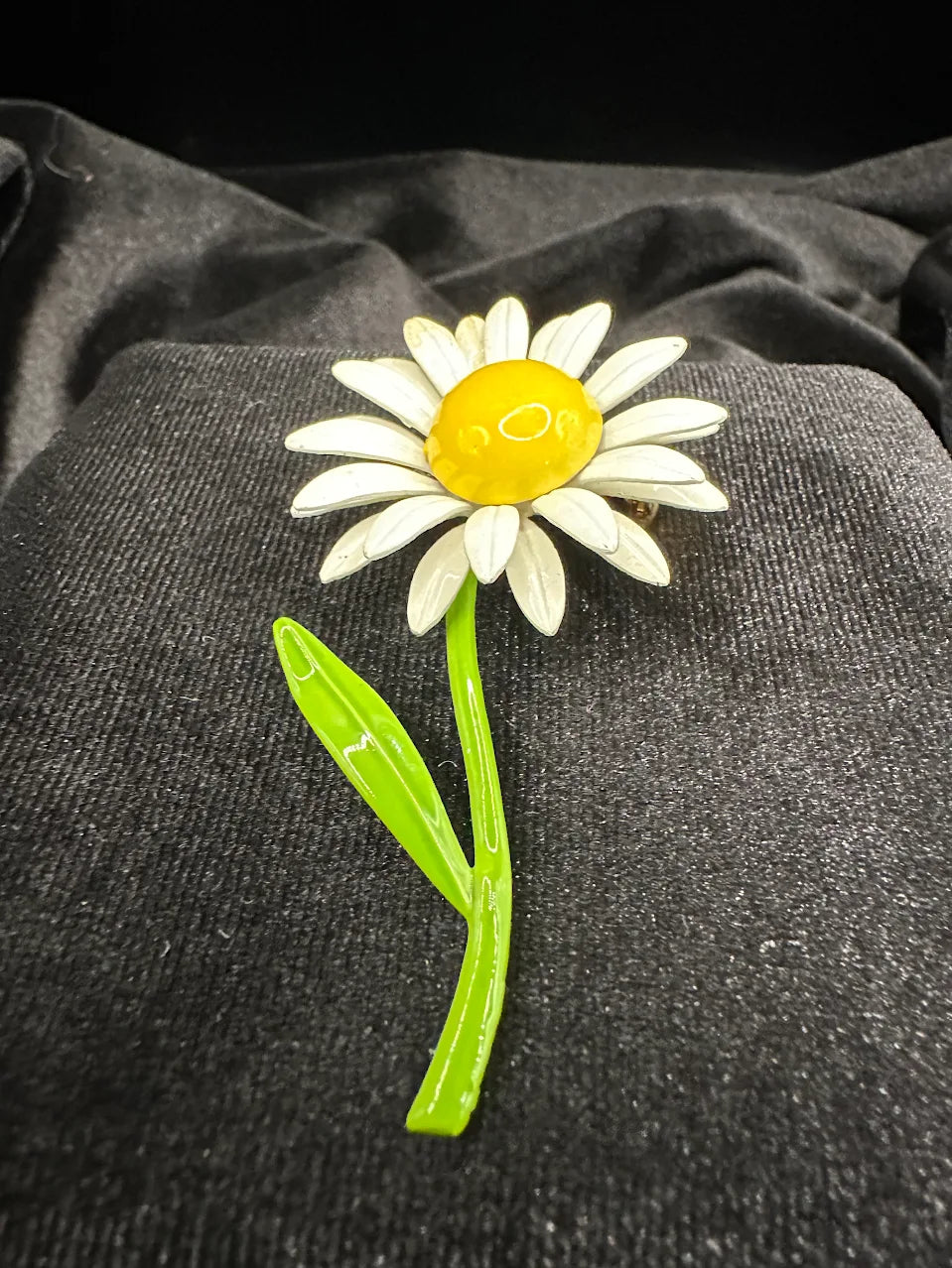 White daisy brooch with yellow center and long green stem with single leaf, view 2